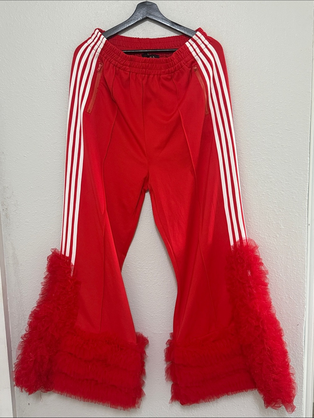 Red Track Pants with White Stripes and Feathered Hem